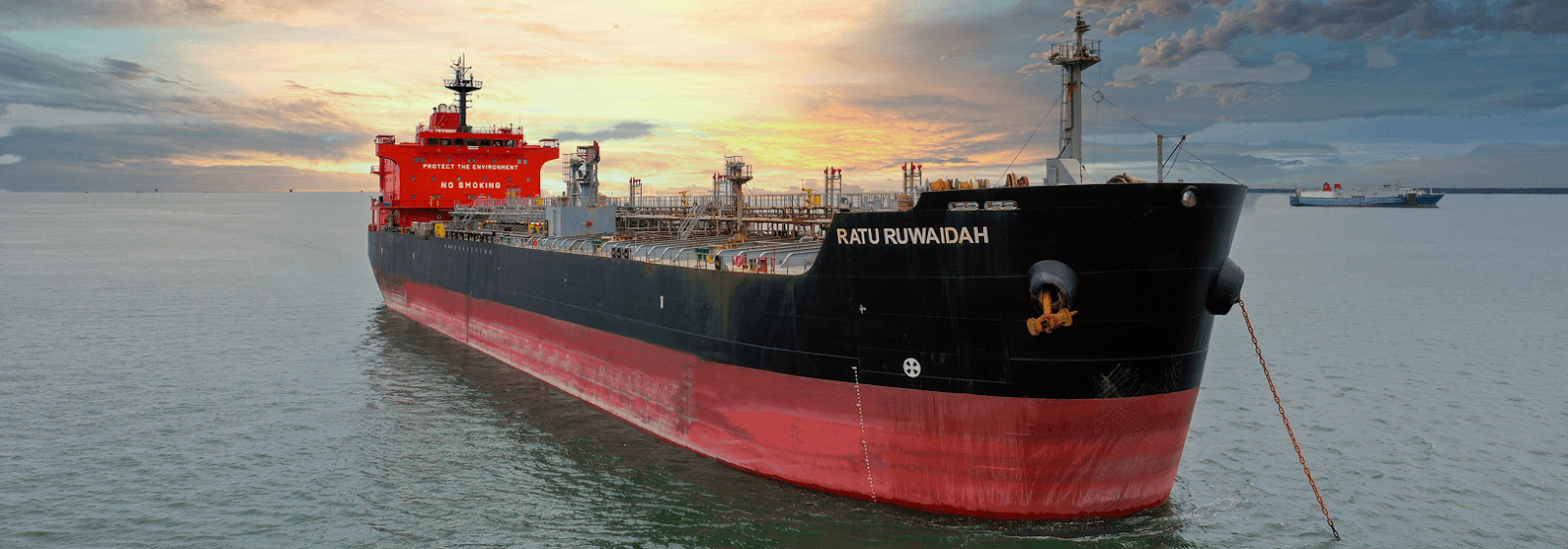 Tanker vessel Ratu Ruwaidah sailing on open sea at sunset